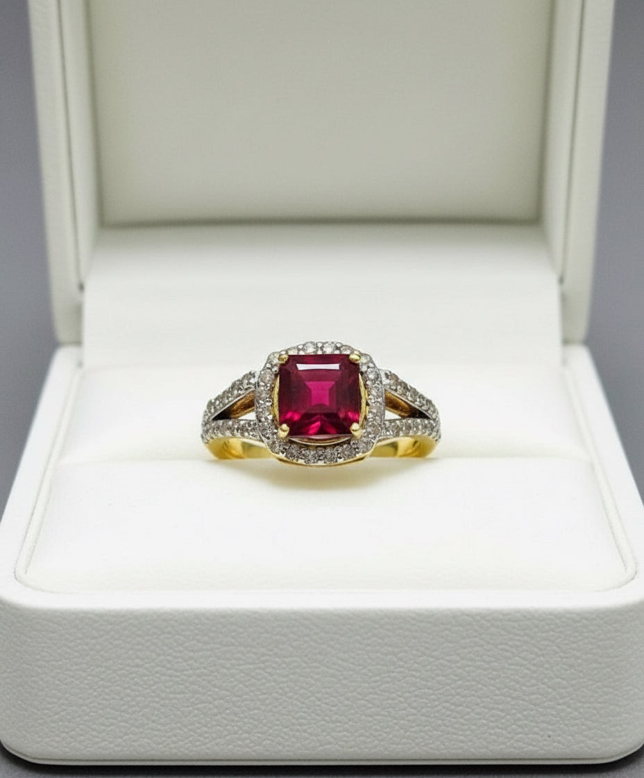 Exquisite genuine ruby and natural diamond ring in gold, front view on white setting.