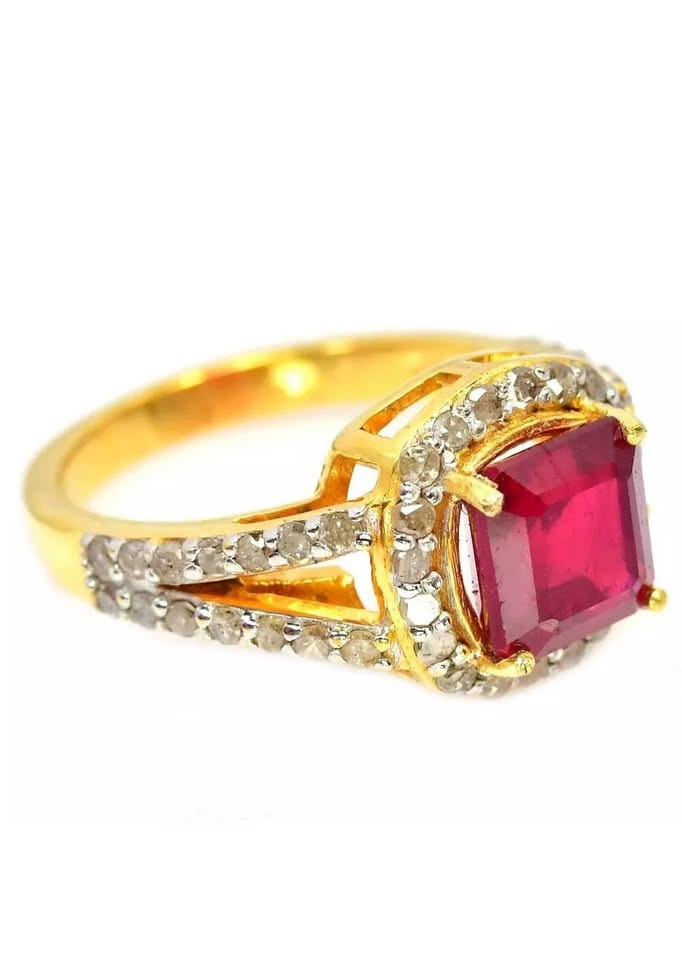 Genuine square-cut ruby and natural diamond ring in gold, side view, dazzling on white.