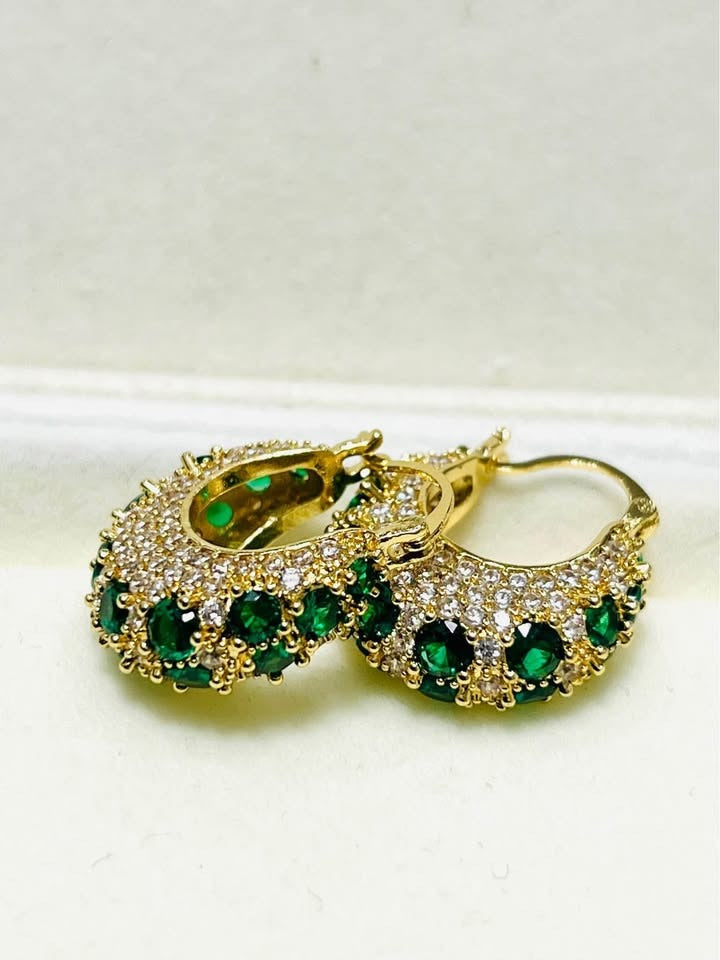 Sparkling gold-filled hoop earrings featuring brilliant emerald green zircon and white pave.