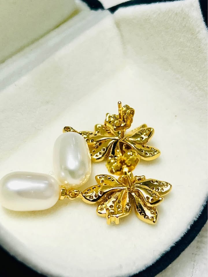 Back view of sterling silver gold vermeil natural pearl drop earrings, showing post and butterfly closure.