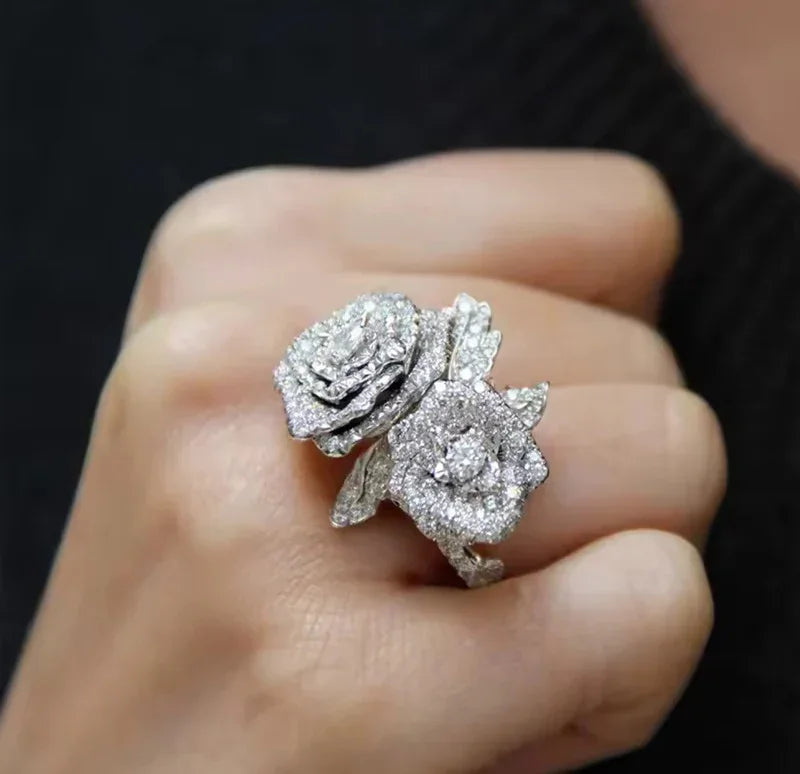 Hand modeling a captivating rose-shaped gold vermeil CZ statement ring, ideal for special occasions.
