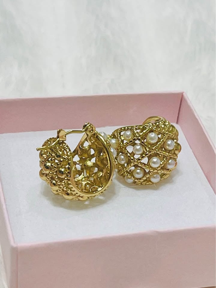 Angled view of handcrafted 18k gold-filled seed pearl hoop earrings, showcasing the delicate craftsmanship.