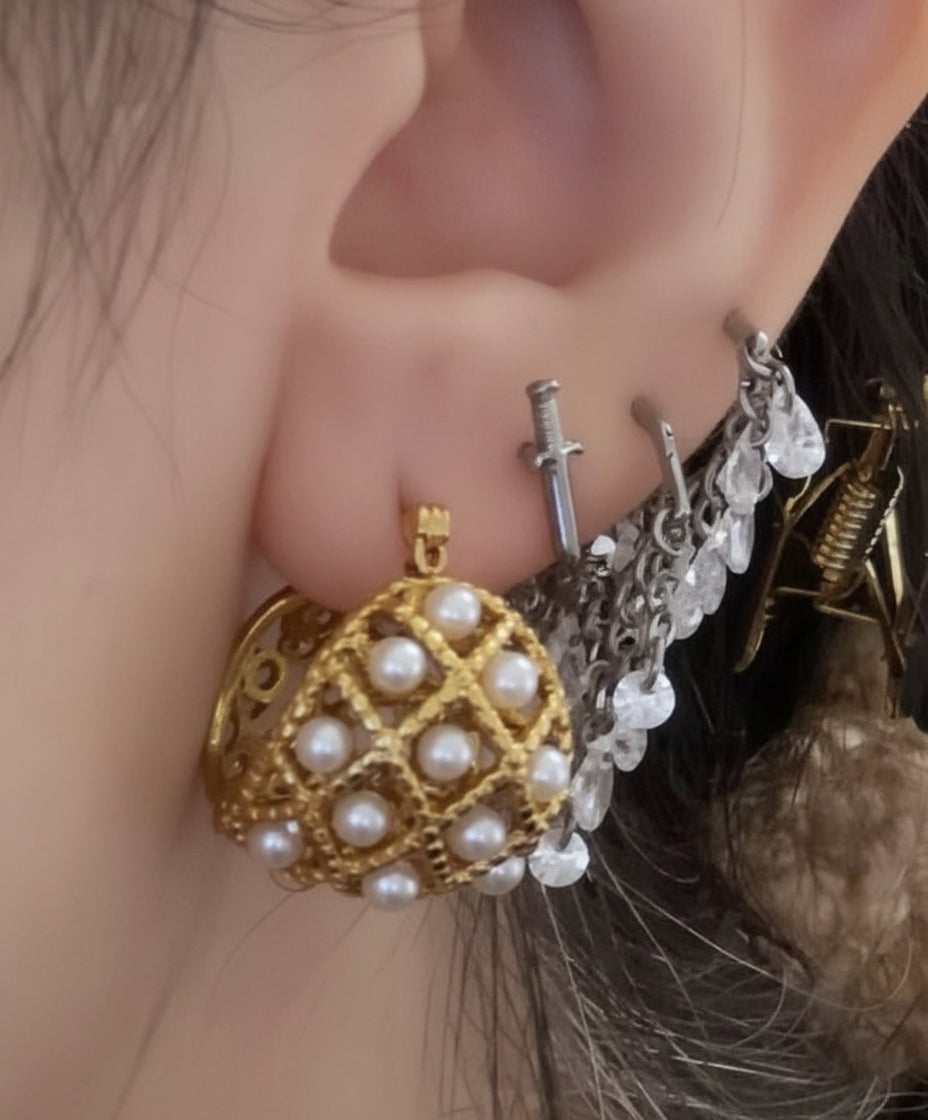 Two sizes of handcrafted 18k gold-filled seed pearl hoop earrings, displayed together to show the comparison.