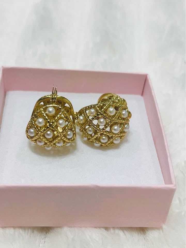 A close-up of handcrafted 18k gold-filled seed pearl hoop earrings on a clean white background.