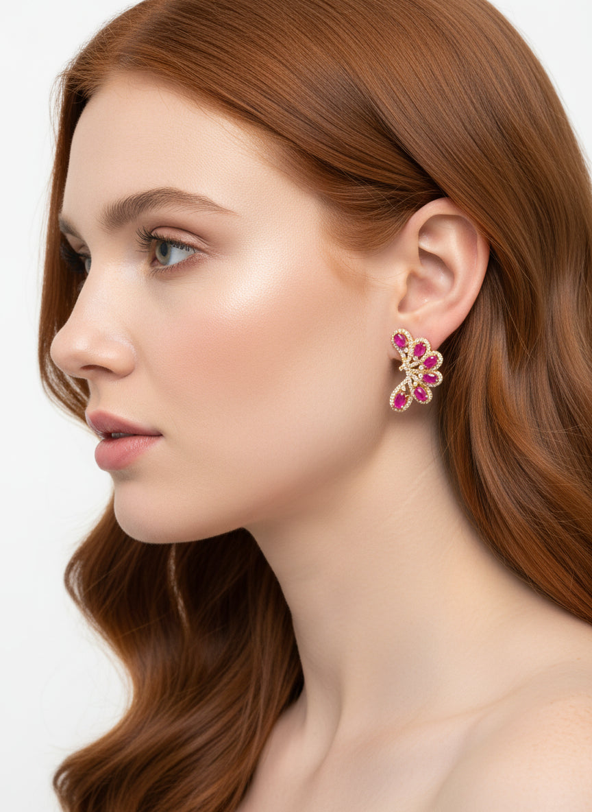 Mannequin wearing genuine 925 sterling silver ear climbers. They are set with natural ruby and pink sapphire gemstones.