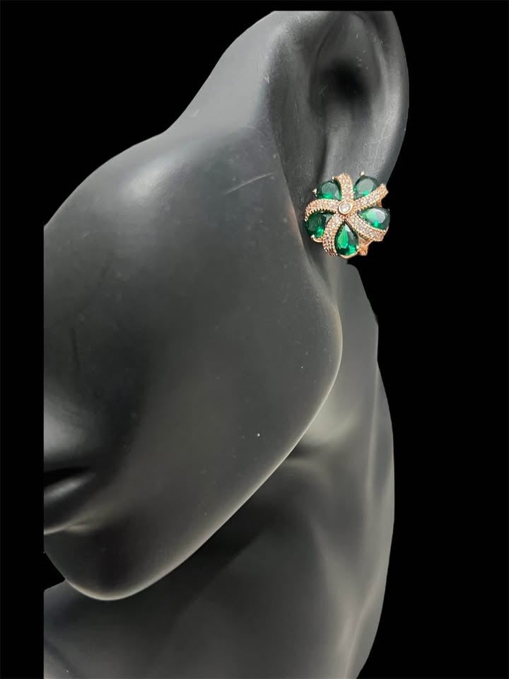 Model showcasing 14K rose gold green topaz floral earrings, elegant and vibrant.
