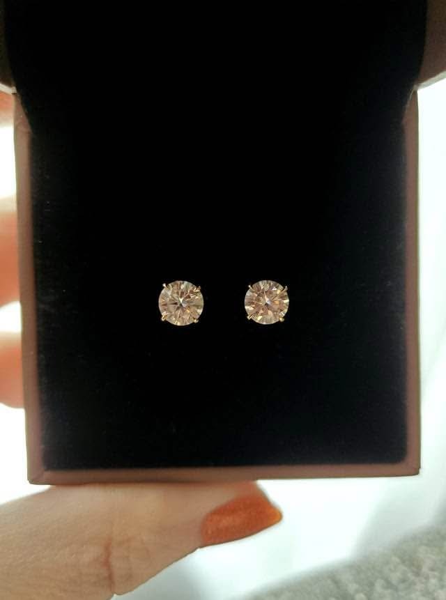 14k gold Moissanite stud earrings neatly presented in a dark, elegant gift box, ready for gifting.