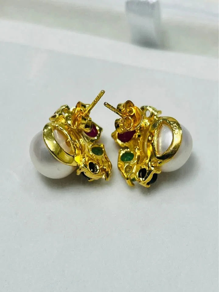  Rear view of South Sea pearl earrings with emeralds, rubies, sapphires, and topaz, showcasing gold setting.