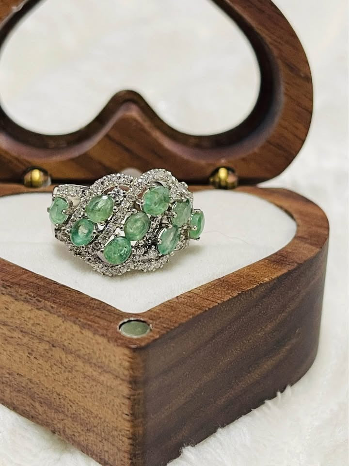  Dazzling natural emerald ring in 925S sterling silver, showcasing multiple oval emeralds and pave-set accents.
