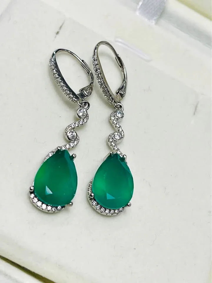 Sterling silver dangle earrings featuring teardrop-shaped green agate stones, set with sparkling accents.