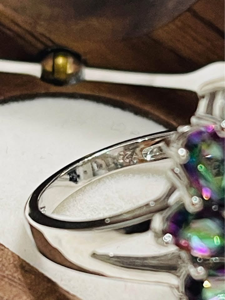 Macro shot of a ring band, showing the clear 925 sterling silver hallmark stamp.