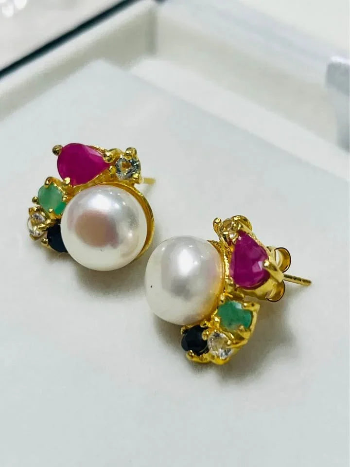 Exquisite South Sea pearl earrings featuring vibrant Colombian emeralds, rubies, sapphires, and topaz.