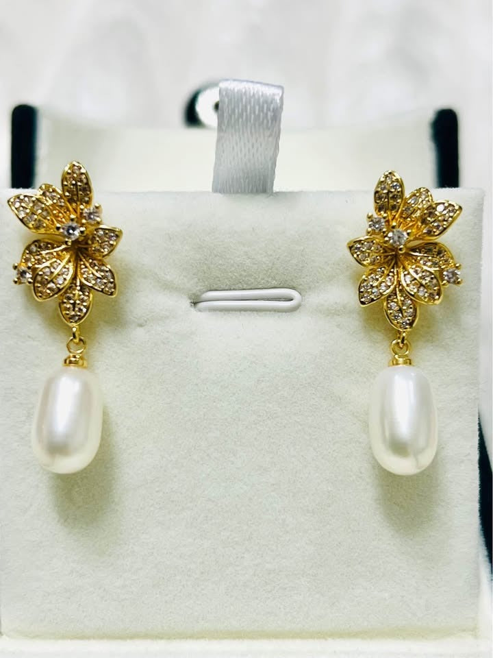  Charming sterling silver gold vermeil natural pearl drop earrings with intricate flower detailing.