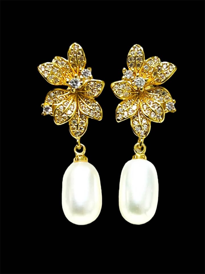 Stunning natural pearl drop earrings in gold vermeil sterling silver with flower-shaped cubic zirconia tops.