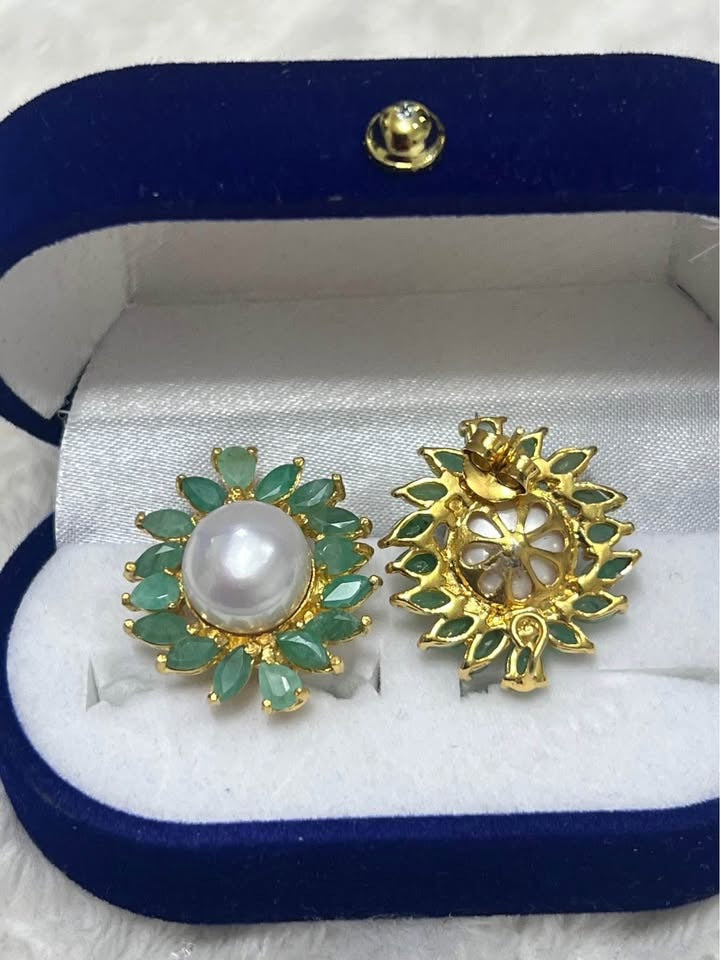 Natural South Sea pearl and marquise emerald earrings, showing both front and intricate back in a blue box.
