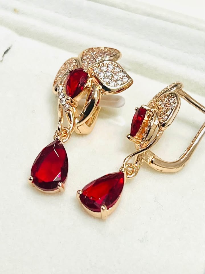 Back and side view of 14k 585RG stamped red fancy teardrop dangle earrings.