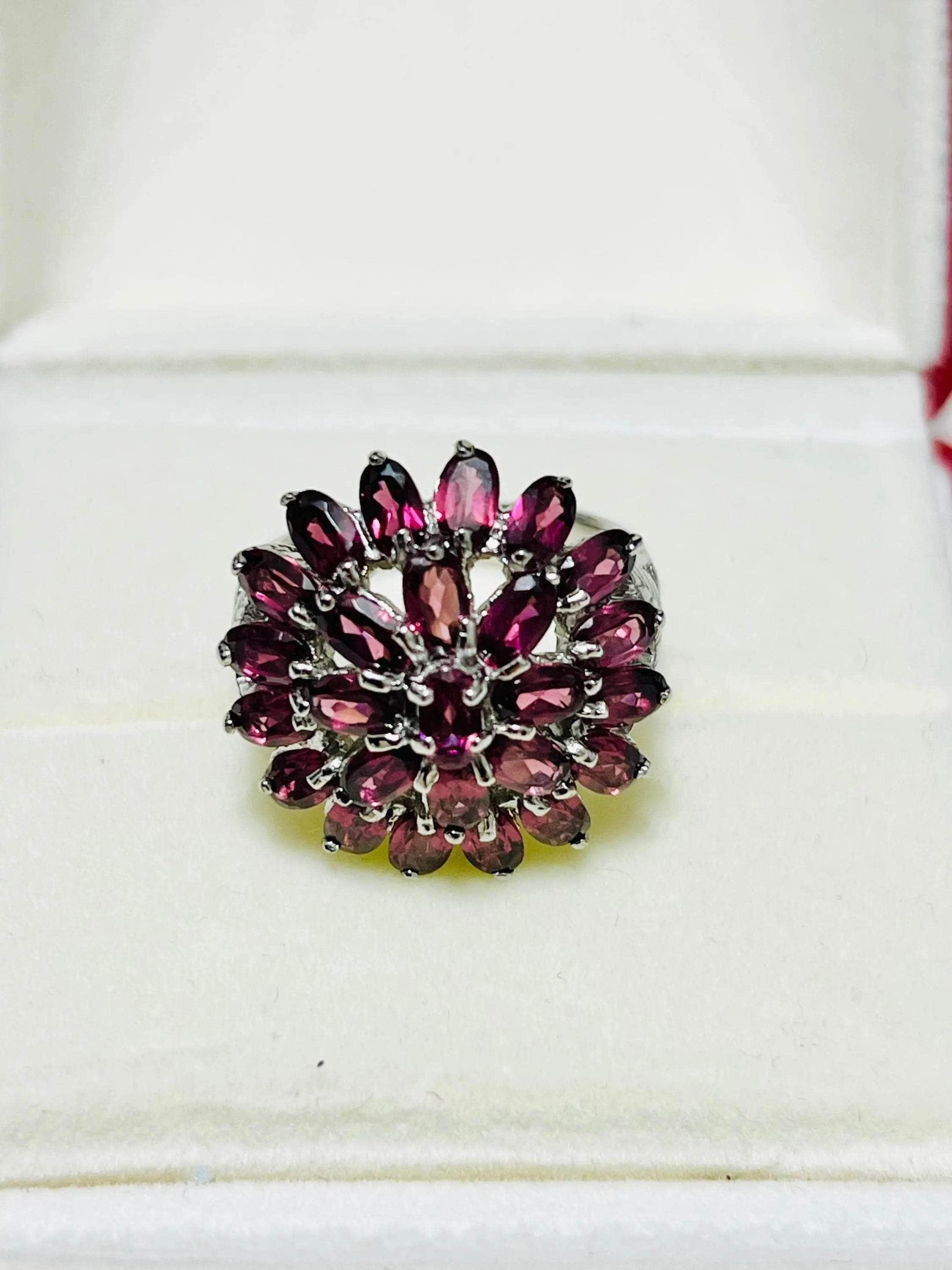 Vintage Bochic rhodolite garnet ring in an open white display box, capturing its full, elegant frontal view.
