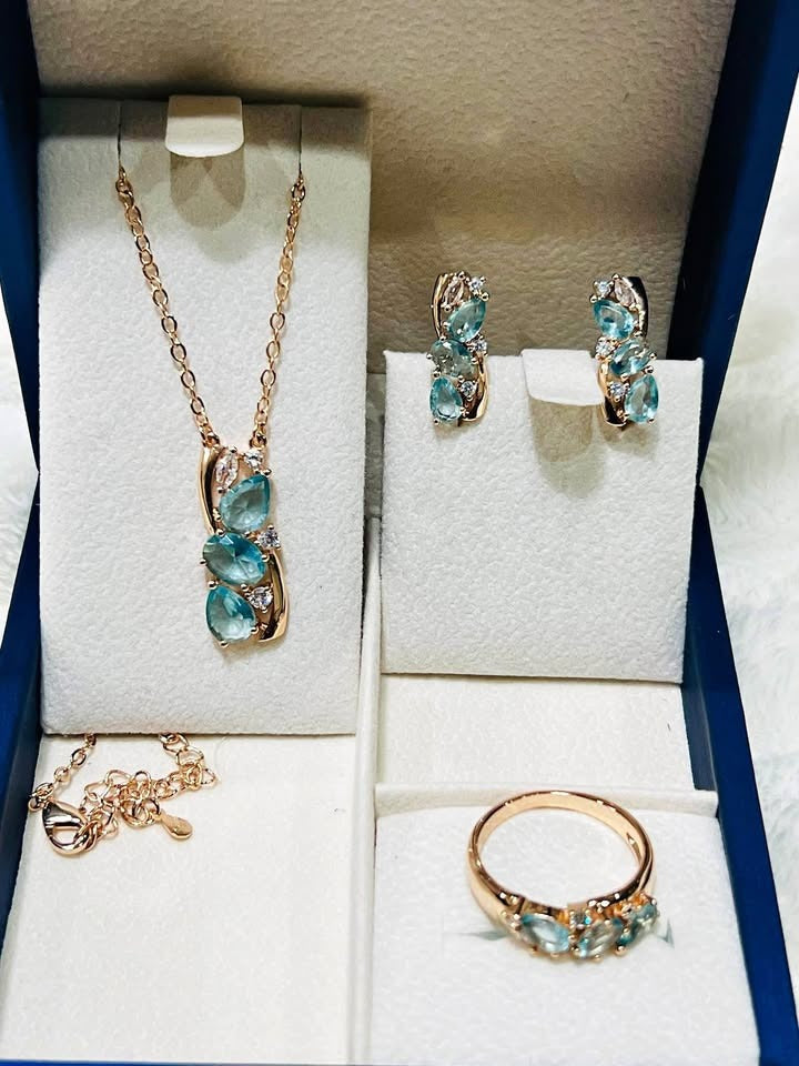  Elegant rose gold jewelry set featuring natural blue aquamarine gemstones and sparkling diamond accents, ready for gifting.