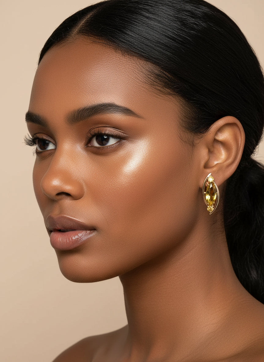 Rose gold citrine earrings displayed on a black mannequin, highlighting their elegant design.