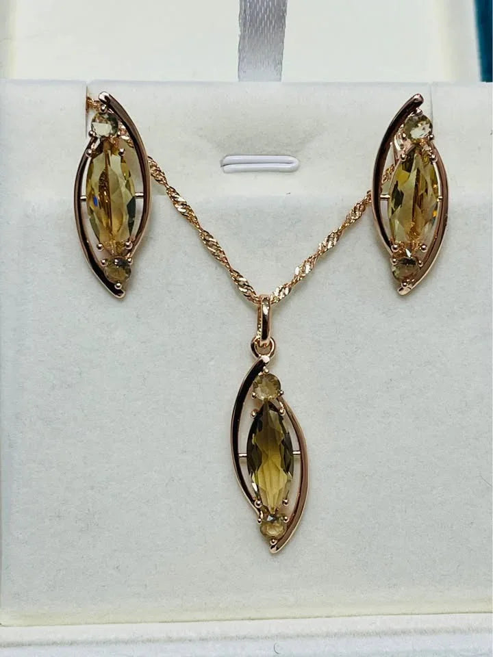 585RG rose gold citrine necklace and earring set, showcasing marquise-cut stones on white.