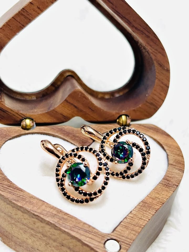 Pair of 585RG rose gold earrings with vibrant mystic topaz and black spinel accents, in a heart box.