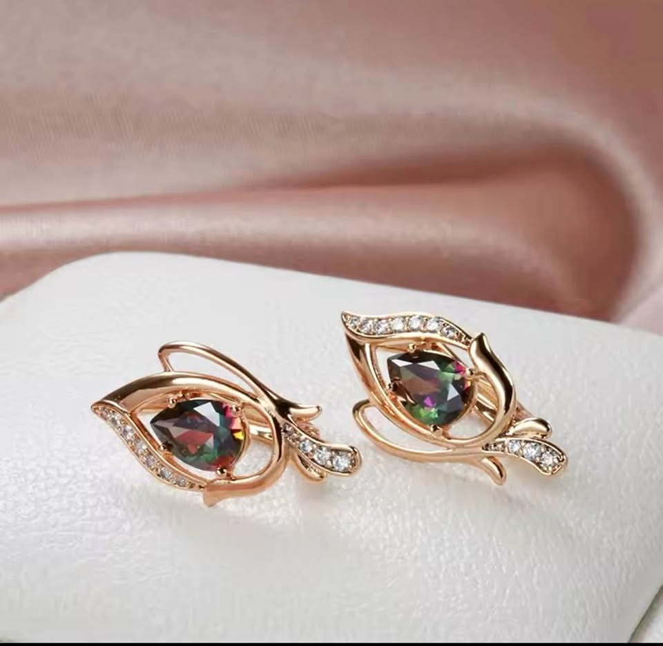 Stunning 14K rose gold-filled leaf design earrings featuring pear-shaped mystic topaz and sparkling accents.