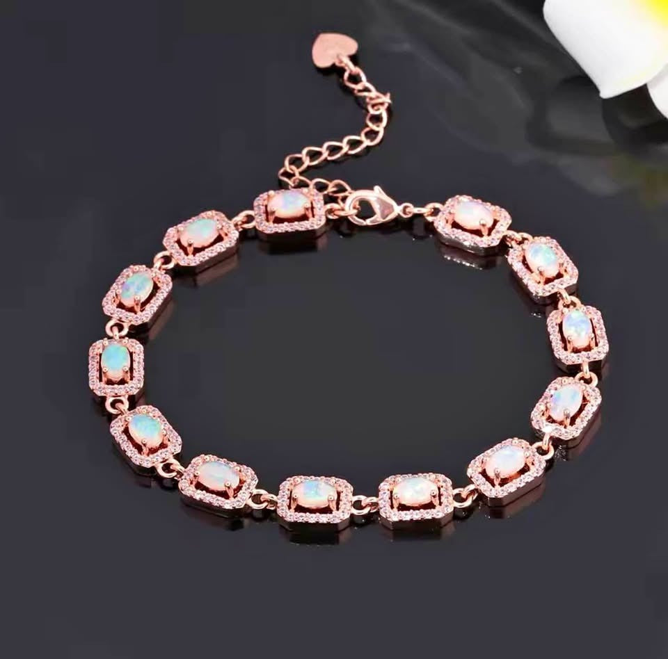  Elegant 14K gold-filled onyx dove dangle earrings with sparkling accents, presented in a teal gift box.