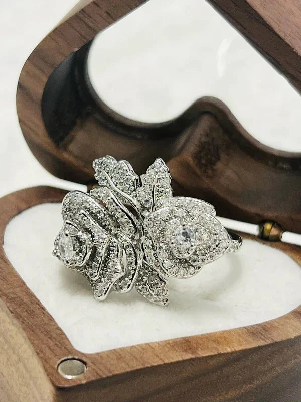 Rose-shaped gold vermeil CZ statement ring, glistening inside a heart-shaped wooden gift box.