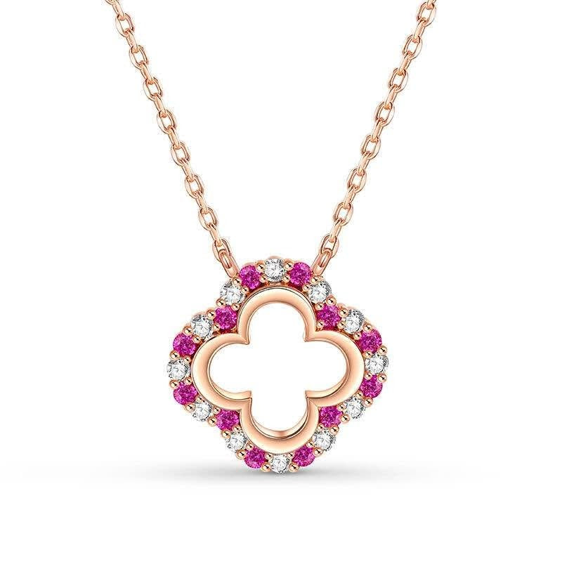 Elegant rose gold clover necklace with a hollow center, adorned with sparkling ruby and moissanite stones.
