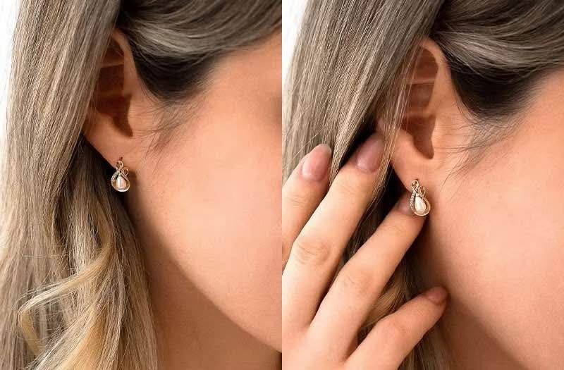 Model wearing 585RG stamped 14K equivalent rose gold teardrop pearl earrings, showcasing their fit.