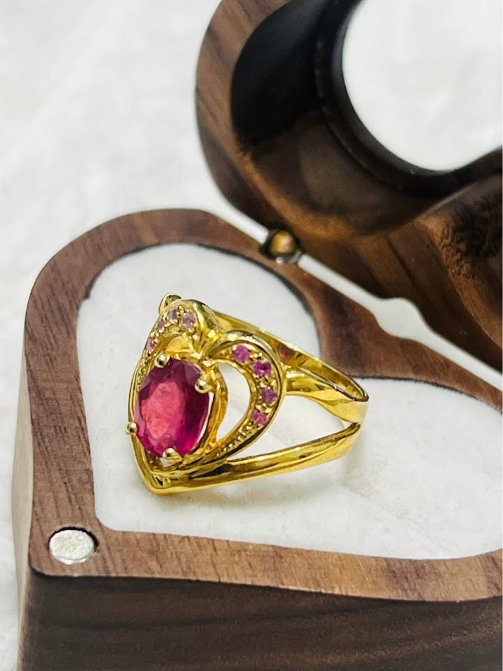 Side view of genuine ruby heart-shaped ring with gold-plated sterling silver, unique design.