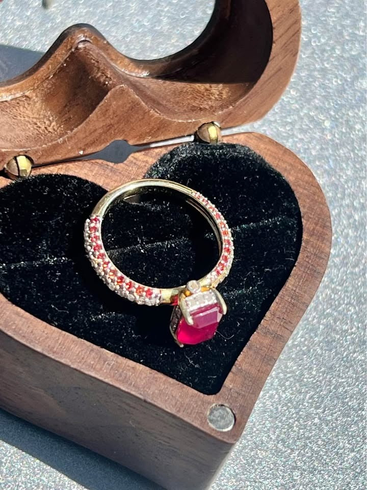 Natural ruby and diamond ring displayed elegantly in a gift box.