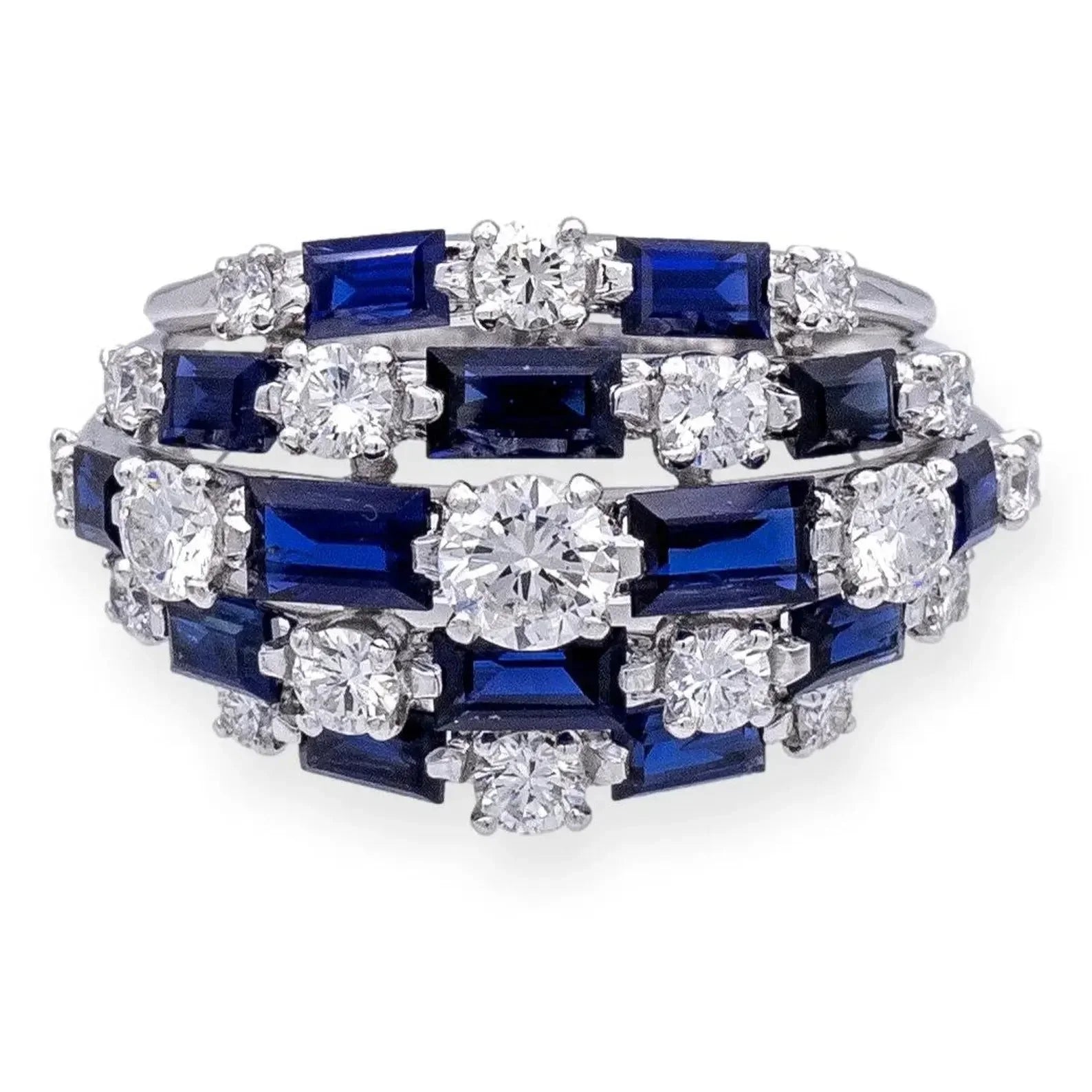 Front view of a vintage-inspired sterling silver statement ring with blue sapphires and white diamonds.