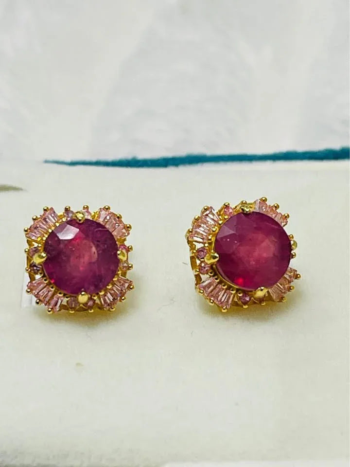 Side view of a floral cluster ring. Showcases a beautiful mix of tanzanite, emerald, and other multi-colored gems