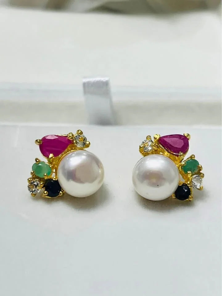 Luxurious South Sea pearl stud earrings adorned with natural Colombian emeralds, rubies, sapphires, and topaz.