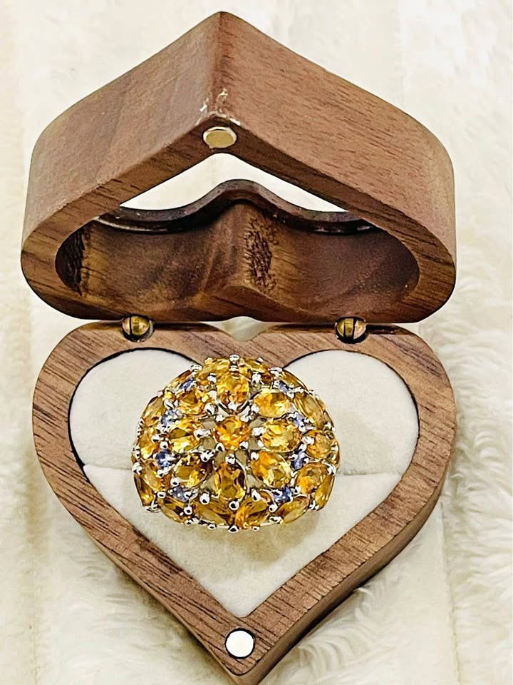 Sterling silver citrine and tanzanite ring displayed in an open heart-shaped wooden box, ready for gifting
