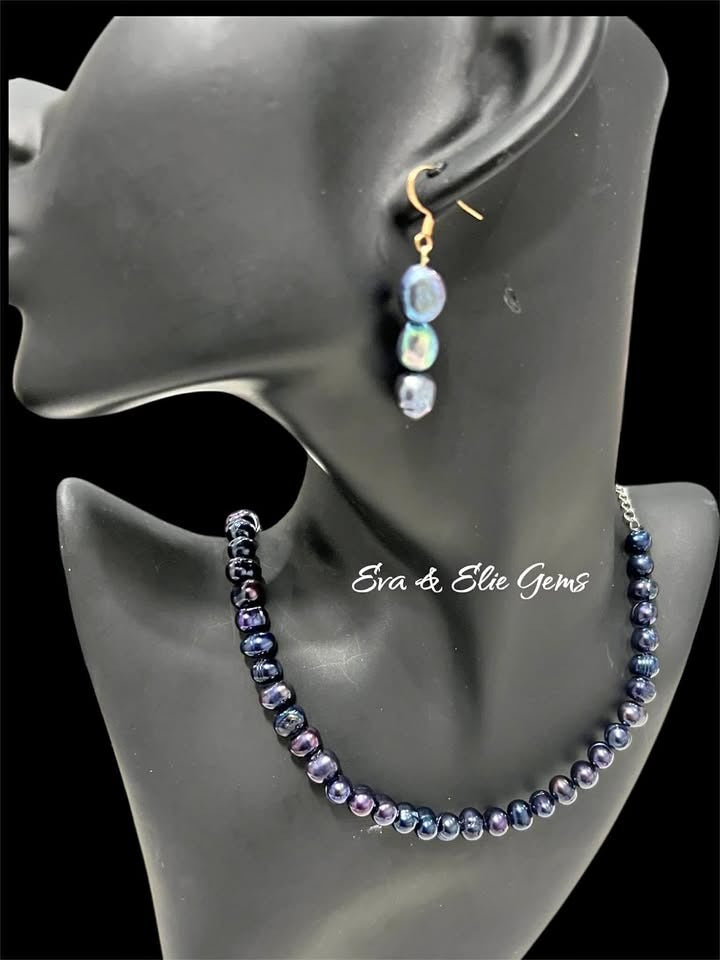  Natural Tahitian black pearl necklace and matching drop earrings displayed on a black mannequin.