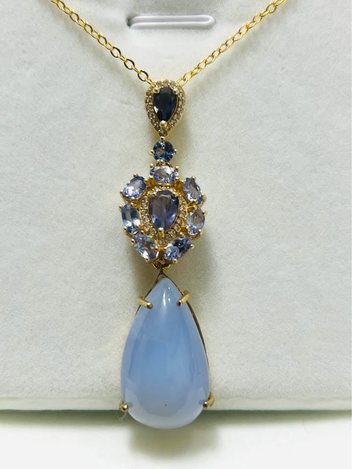 Convertible 28 ct natural tanzanite and blue sapphire pendant with detachable lower piece.
