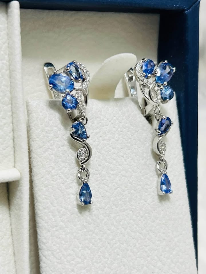 Elegant cluster earrings featuring multiple natural tanzanite stones and sparkling CZ accents.
