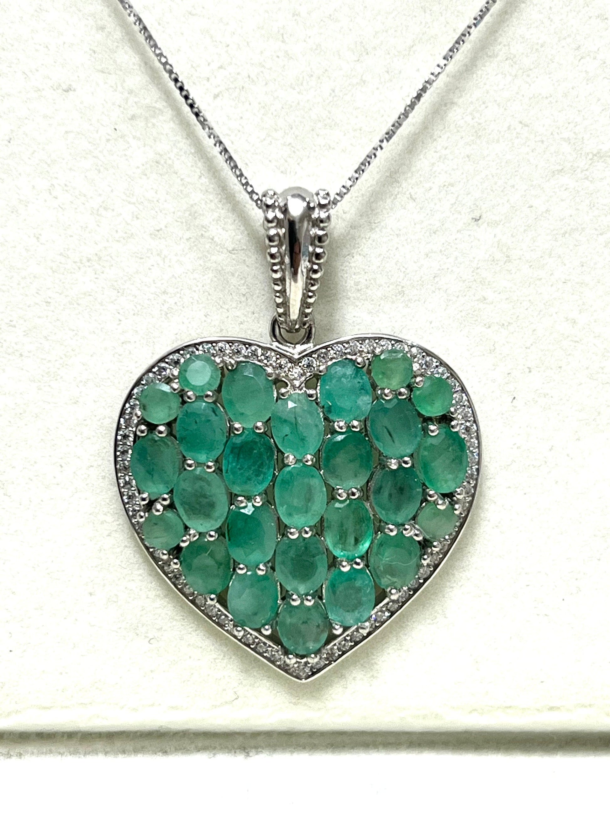 Heart pendant with unheated, untreated Colombian emerald cluster and diamond accents.
