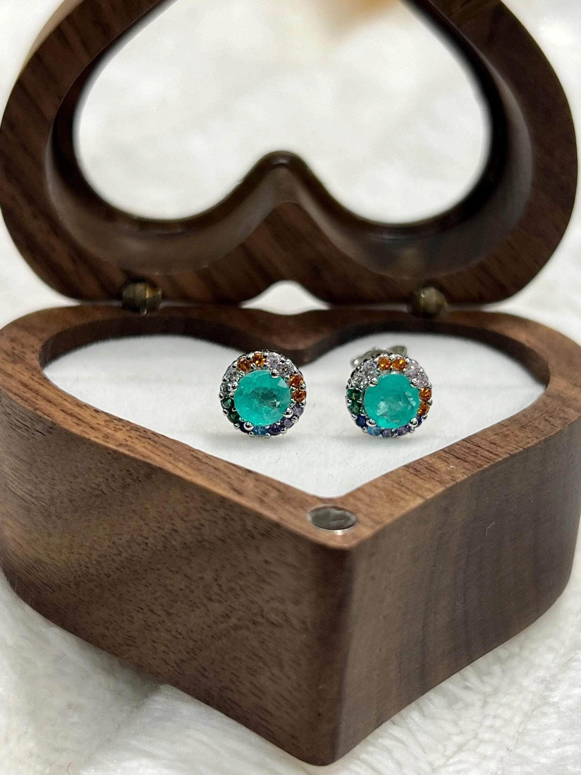 Unique Paraiba Tourmaline earrings, perfect for a gift, presented in an elegant heart-shaped wooden box.
