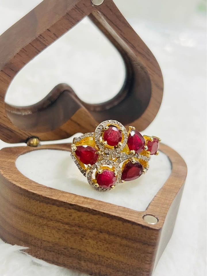 Stunning vintage-inspired ruby and diamond ring in sterling silver, showcased within a beautiful wooden jewelry box.