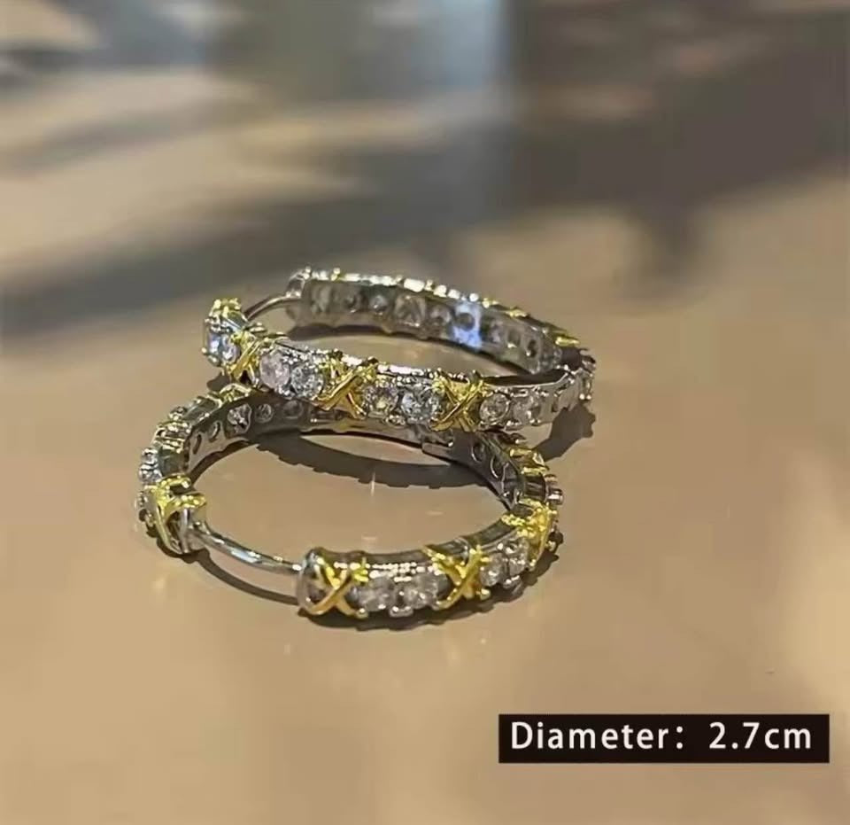Gold plated silver XOXO hoop earrings with cubic zirconia, showing 2.7cm diameter.