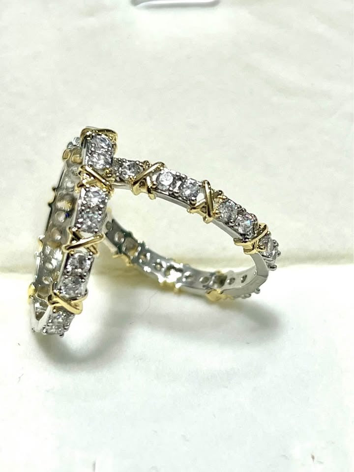  Angled view of XOXO exquisite hoop earrings, gold plated silver with brilliant stones.
