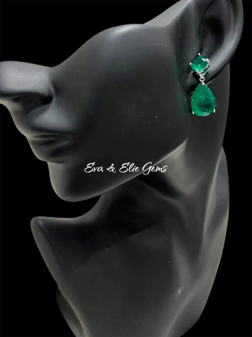 Elegant Zambian emerald doublet earrings displayed on a black mannequin, showcasing their wearability.
