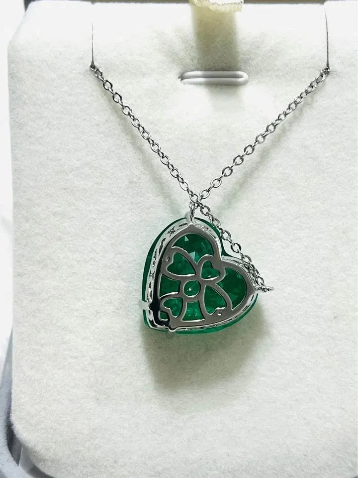 Back view of a Zambian emerald doublet heart necklace, showing intricate silver setting details.