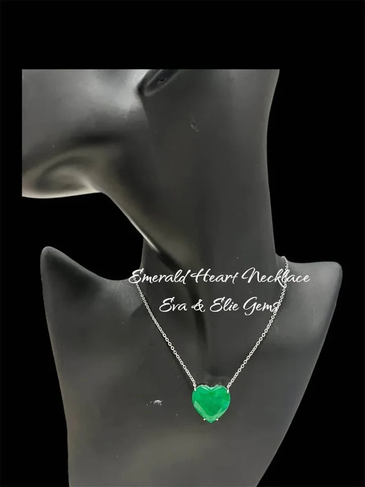 Zambian emerald doublet heart necklace on a black jewelry mannequin, highlighting its elegance.