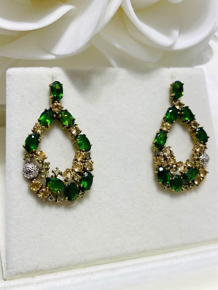 Handcrafted dangle earrings featuring natural chrome diopside and yellow sapphire gemstones.