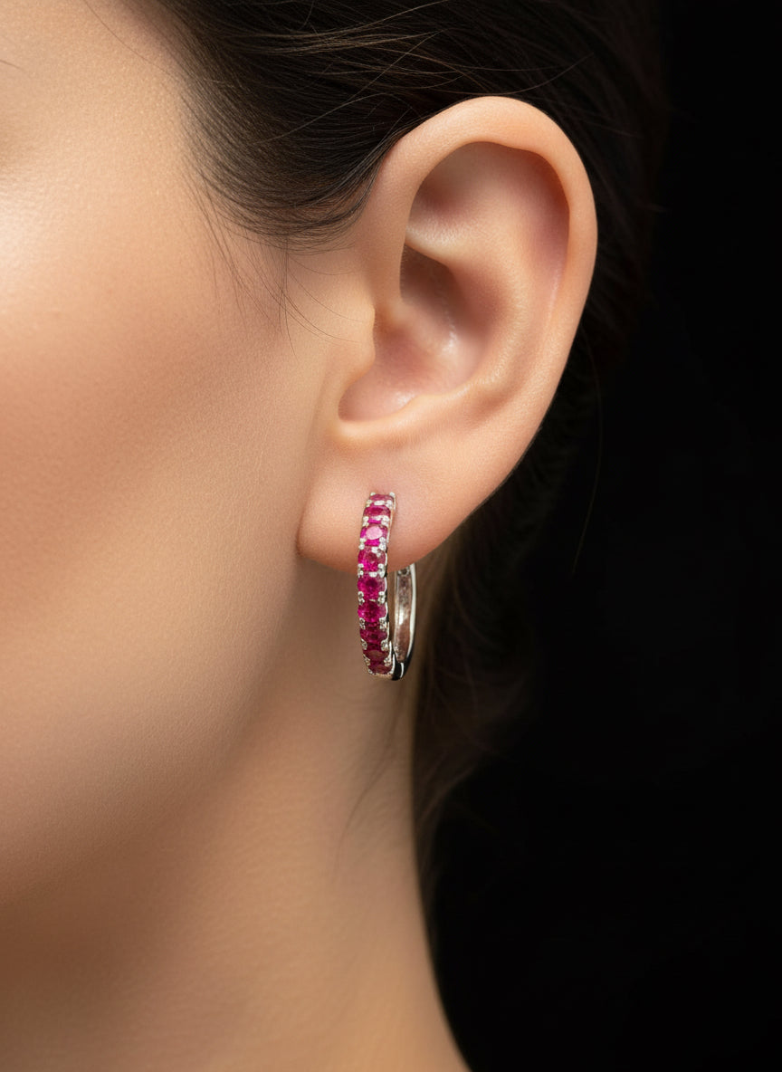 Natural ruby sterling silver hoop earring on a mannequin, showcasing how it looks when worn.
