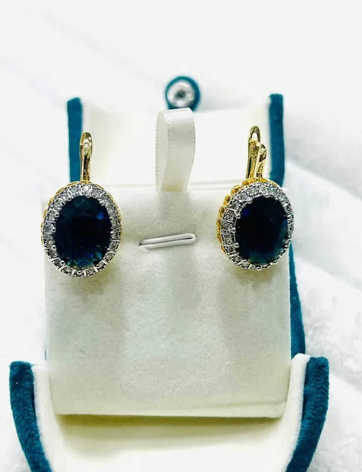 Elegant oval blue sapphire earrings with a CZ halo in beautiful 18k vermeil gold setting.
